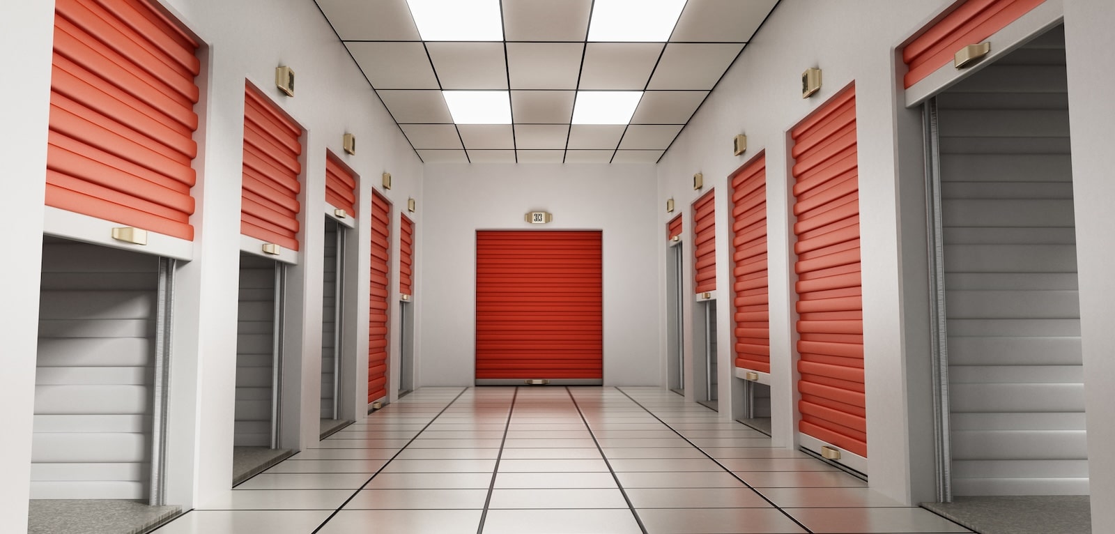 Indoor storage facility with red-orange roll-top doors demonstrating the need to grow occupancy through promotions and discounts.