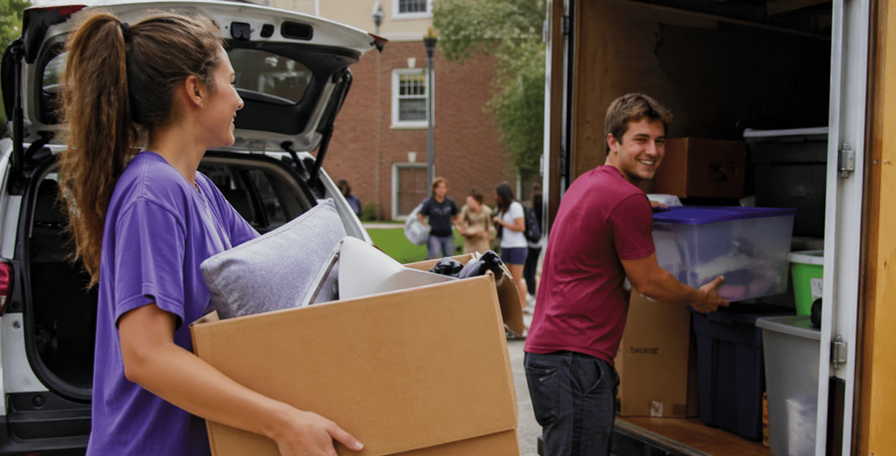 Students moving boxes for the summer